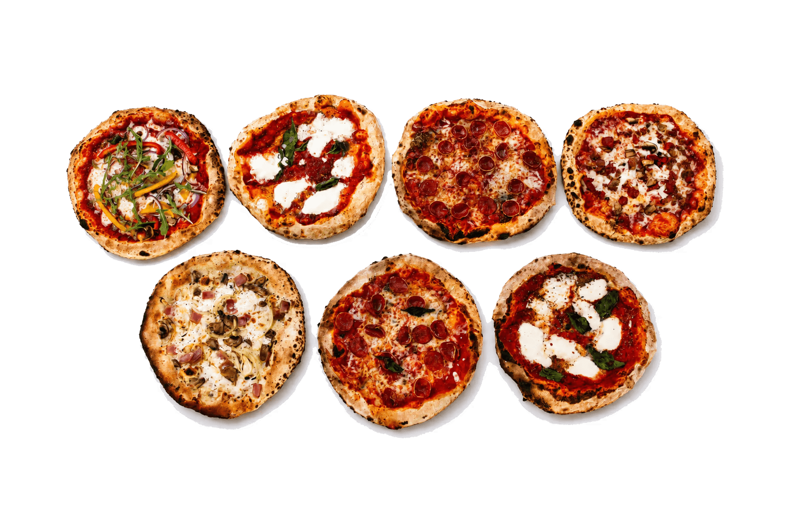 Variety of wood-fired pizzas arranged for buffet service